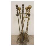 1313	SET OF BRASS FIREPLACE TOOLS IN CAST IRON HOLDER