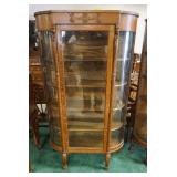 1045	CURVED GLASS OAK CHINA CABINET W/LION HEADS & CLAW FEET, 38 1/2 IN WIDE X 65 1/2 IN HIGH X 15 I