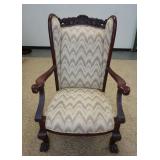 1049	CARVED UPHOLSTERED WING BACK ARM CHAIR, CLAW FEET, 30 1/2 IN WIDE X 45 IN HIGH