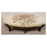 1052	FLORAL CARVED UPHOLSTERED OVAL STOOL, 27 IN X 14 IN X 10 IN HIGH