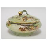 1142	HAND PAINTED DRESSER BOX W/ACORNS, LEAF FINIAL, ARTIST SIGNED R MERRELL, 6 3/4 IN DIAMETER