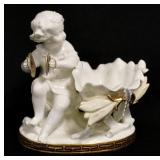 1146	MOORE PORCELAIN FIGURE, CHILD W/SYMBOLS & FLOWER FORM BOWL W/CHIP ON THE EDGE, 6 IN WIDE X 5 3/