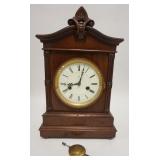 1150	GERMAN VICTORIAN CLOCK, CARVED CASE, 10 1/4 IN WIDE X 15 1/2 IN HIGH