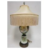 1161	HAND PAINTED GLASS LAMP, WOMAN & CHERUBS, COMES W/FRINGED CLOTH SHADE, 31 1/2 IN HIGH