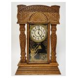 1196	PRESSED OAK GINGERBREAD CLOCK W/PAINTED DOOR, 14 3/4 IN WIDE X 22 3/4 IN HIGH