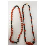 1283	2 CINNABAR & BLACK BEAD NECKLACES, APPROXIMATELY 28-29 1/4 IN