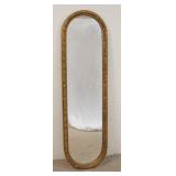 1299	TALL OVAL MIRROR, FRAME HAS RELIEF FLORAL DECORATION, 55 IN HIGH X 15 3/4 IN WIDE