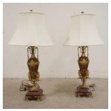 1002	PAIR OF BRONZE MOUNTED RED MARBLE LAMPS, DECORATED W/WINGED GRIFFENS & LADIES FACES, ONE FOOT O