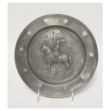 1120	PEWTER PLATE W/EMBOSSED KNIGHT ON HORSEBACK, INSCRIBED MR, 1773, HAS A MARK ON BACK, 9 1/2 IN