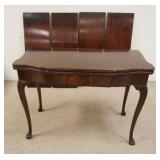 1142	HENRY F MILLER FURNITURE CORP FLIP TOP EXTENSION TABLE, HAS 4-14 IN LEAVES, TOP SURFACE HAS LIG