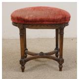 1167	CARVED UPHOLSTERED STOOL W/CARVED SKIRT & STRETCHER BASE, 21 IN X 14 IN X 20 1/2 IN HIGH