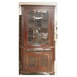 1172	ANTIQUE 2 PIECE 12 PANED CORNER CUPBOARD, TOP WINDOWS ARCHED, ONE FRONT FOOT HAS BEEN ALTERED, 