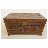 1176	DEEPLY CARVED SCENIC LIFT TOP CHEST, 36 3/4 IN X 18 IN X 21 1/4 IN HIGH