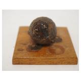 1300	PIECE OF GRAPE SHOT, 18TH CENTURY, WOODEN BASE IS ANNOTATED, 1 IN SPHERE