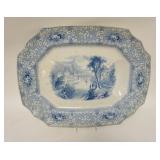 1302	MILAN PATTERN BLUE TRANSFER WELL & TREE PLATTER, HAS BASE CHIP & GLAZE FLAKE ON THE RIM, 20 1/2