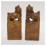 1065	PAIR OF ASIAN STONE CARVINGS, FOO DOGS, ONE HAS A SMALL REPAIR ON THE SIDE