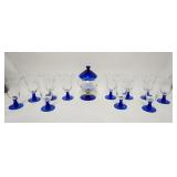 1130	20 PIECE COBALT BLUE & CLEAR GLASS, 19 GOBLETS & COVERED JAR, JAR HAS NICKS AROUND THE TOP RIM 
