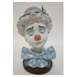 1148	LLADRO CLOWN BUST, COMES W/WOODEN BASE, 8 1/2 IN HIGH