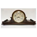 1155	HOWARD MILLER MANTLE CLOCK IN A NICELY CARVED CASE W/WESTMINSTER CHIME, ORIGINAL BRASS LABEL ON