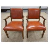 1180	PAIR OF ORANGE/BROWN LEATHER ARM CHAIRS