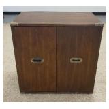 1192	2 DOOR CABINET W/ BRASS HARDWARE. 30 1/4 IN W, 30 IN H, 19 IN DEEP. HAS AN INTERIOR SHELF 