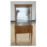 1195	WILLIAM A. BERKEY DISPLAY CABINET A DIVISION OF JOHN WIDDICOMB. HAS THREE DRAWERS , GLASS SHELV