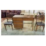 1232	MID CENTURY MODERN DESK & 2 CHAIRS HAS TEARS IN THE VINYL SEATS. DESK HAS A FORMICA TOP. 42 1/4