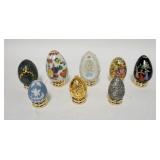 1304	LOT OF 8 DECORATED EGGS, PORCELAIN, METAL & STONE, ALL W/STANDS