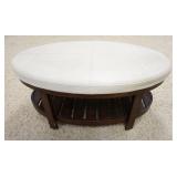 1048	UPHOLSTERED STOOL/BENCH W/ A BOTTOM SHELF. 44 IN X 27 IN, 19 IN H 