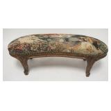 1087	CARVED UPHOLSTERED KIDNEY SHAPED STOOL, UPHOLSTERY IS SCENIC. 23 1/4 IN X 10 IN 