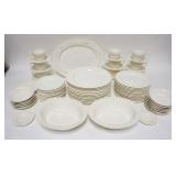 1232	72 PC WEDGWOOD EMBOSSED QUEENSWARE IVORY DINNERWARE, SOME STAINING PLATTER IS 14 1/2 IN 