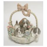 1235	LLADRO BASKET OF PUPPIES, CHIP ON ONE OF THE FLOWER PETALS. 5 1/2 IN H 