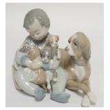 1243	LLADRO BOY W/ PUPPIES IN HIS ARMS 5 IN H 