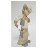 1244	LLADRO YOUNG COWBOY W/ SHERRIFS STAR 10 3/4 IN H 