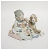 1248	LLADRO CHILD W/DOG & PUPPIES IN HIS ARMS, 6 1/2 IN WIDE X 5 IN HIGH