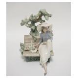 1250	LLADRO GIRL ON A PARK BENCH W/A BASKET OF FLOWERS, TREE BEHIND, 2 DOVES, 8 1/2 IN HIGH X 6 IN W