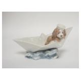 1253	LLADRO PUPPY IN A BOAT W/SAILING HAT, 6 3/4 IN WIDE X 4 IN HIGH