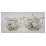 1261	SIGNED RS PRUSSIA CREAMER & COVERED SUGAR, SUGAR IS 4 7/8 IN HIGH