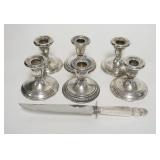 1315	3 PAIRS OF WEIGHTED STERLING SILVER CANDLESTICKS, 2 PAIRS ARE MATCHED, SOME TWISTIN IN THE STEM