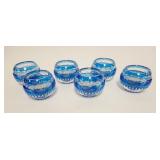1058	6 FABERGE BLUE CUT TO CLEAR TEA LIGHTS, SIGNED ON TOP RIM