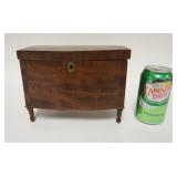 1117	ANTIQUE TEA CADDY IN THE FORM OF A BLANKET CHEST W/ TURNED LEGS, BOW FRONT, DOVETAILED. 8 1/2 I
