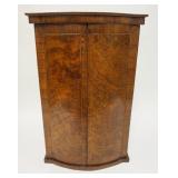 1133	ANTIQUE TWO DOOR HANGING CABINET BURL SERPENTINE DOOR FRONTS. 24 IN H 13 3/4 IN H, 16 IN DEEP