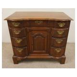 1136	ANTIQUE SMALL CHEST W/ 8 DRAWERS & ONE PANELED DOOR, SERPENTINE FRONT. 34 IN W, 30 IN H, 19 IN 