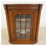 1138	COMTEMPORARY BENCH MADE PINE HANGING CORNER CABINET. 12 INDIVIDUAL GLASS PANE DOOR. 27 IN W, 13