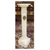 1143	WHITE ONYX PEDESTAL HAS BRASS DECORATIVE MEDALLION, STONE HAS A TIGER TYPE GRAINING. 44 3/4 IN 