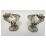1169	PAIR OF SILVERPLATED SHELL DISHES W/ DOLPHIN BASES N4 3/4 IN H 