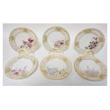 1191	6 HAND PAINTED PLATES W/ RETICULATED RIMS EACH HAS A DIFFERENT FLOWER, ARTIST SIGNED ON THE BAS