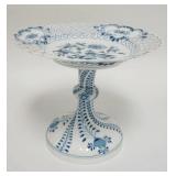 1210	MEISSEN TALL TAZZA BLUE DECORATED W/RETICULATED RIM, HAS 2 SCRATCHES THROUGH THE MARK, 9 1/2 IN