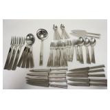 1239	ERCUIS 52 PIECE MODERN FLATWARE SET, LADLE IS 10 1/2 IN