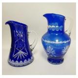 1262	2 BLUE CUT TO CLEAR PITCHERS, TALLEST IS 10 3/4 IN